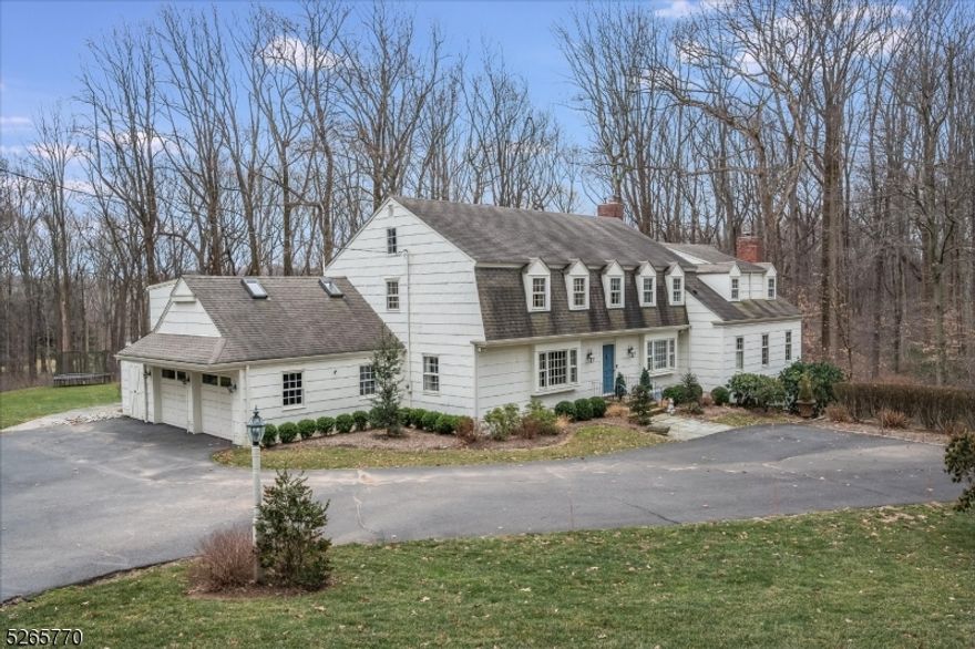 Nestled in the heart of Harding Twp, this exquisite 5 bedroom Colonial offers elegantly comfortable living on a stunning lot in a desirable cul de sac neighborhood. Renovated in 2019, the residence underwent a first floor transformation. The large formal dining room with custom molding, coffered ceilings, and built-in cabinets ensures memorable gatherings. The reimagined kitchen is a chef's dream with architectural features and designer touches including two large islands with Geoluxe quartz countertops. Professional grade appliances and custom cabinetry with sought-after amenities showcase attention to detail. The roomy breakfast area includes a wine bar, built-ins and French doors to the patio. The bright family room features a wood burning fireplace and additional patio access. Sliding French doors open to a formal living room with a gas fireplace ideal for intimate gatherings. Upstairs, the large primary suite has a vanity area, en suite bath and double closets leading to a large laundry/dressing room. Four additional bedrooms and two more bathrooms on this level ensure ample personal space. The lower level is perfect for relaxation and recreation including a finished bonus room with outside access. Set on beautiful grounds, this gem offers a private stone patio and expansive yard. A whole house generator provides peace of mind. A wonderful blend of gorgeous design and modern amenities in close proximity to the vibrant downtowns of Bernardsville, Morristown and Madison.
