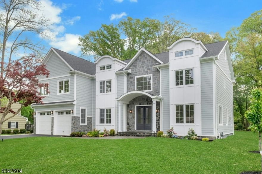 This stunning 7-bedroom, 8.1-bathroom colonial new construction offers over 7,700 square feet of meticulously finished living space across 4 finished levels. This home boasts an expansive open floor plan, white oak hardwood flooring and dramatic white oak staircase. Soaring 10' ceilings on the main level and 9' on the second floor and fully finished basement. Abundant natural light floods the interiors through large European tilt-and-turn windows. The heart of the home is a true gourmet kitchen featuring ceiling-height custom cabinetry, a massive center island, top-of-the-line Viking appliances, and a large furnished hidden pantry. Every bedroom is an ensuite with its own private bathroom and walk-in closet. The luxurious primary suite is a standout, highlighted by a vaulted ceiling in the bedroom and a spa-like master bathroom with heated floors and Grohe plumbing fixtures. Additional premium features include three high-efficiency HVAC units with five-zone Nest thermostats, a dedicated EV charger, and pre-wiring for a 5-zone audio system, security system, and WiFi. Outside, the residence is wrapped in premium HardiPlank siding and shingles, custom Azek trim, and striking stone entry. The grounds are enhanced by a large patio, meticulous landscaping, multi zoon sprinkler system and architectural outdoor lighting that beautifully illuminates the home's elegant facade after dark.