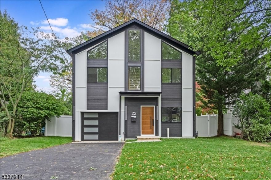 A stunning 4 bedroom, 4 full and 1 half bath BRAND NEW CONSTRUCTION residence seamlessly blending modern luxury with classic charm. This exceptional smart home features an open concept living area on 1st level, electric fireplace in living room, vaulted ceilings in the 2nd floor bedrooms, a 3rd floor ensuite retreat, and a finished walk out lower level with guest room, full bath and media room with wet bar, beverage cooler.   Impeccable design, premium finishes, versatile living spaces, all in the heart of Millburn.  10 year NJ New Home Warranty.