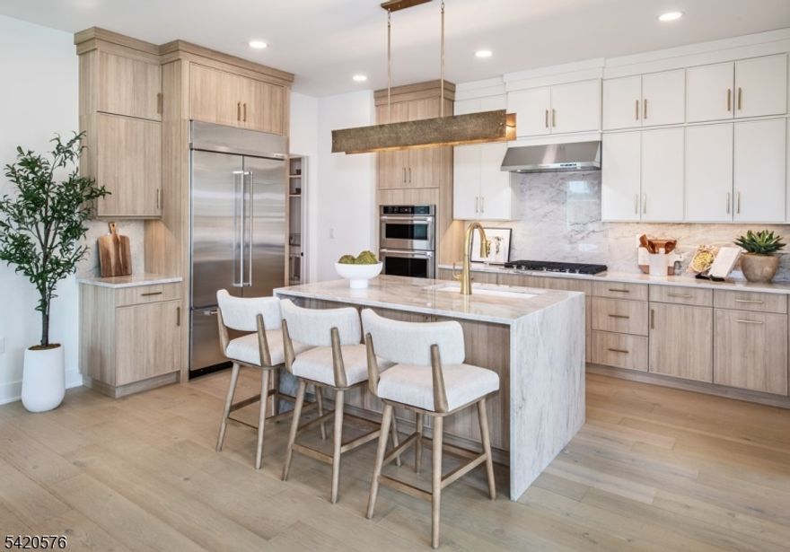 MOVE BEFORE SCHOOL. Welcome to Oaks at Randolph! The Noah perfectly complements every lifestyle with a beautiful blend of spacious living areas and relaxing retreats. An intimate foyer reveals the elegant casual dining area and great room with desirable access to the rear yard. A home office can be found adjacent to the well-equipped kitchen that features a large center island with breakfast bar, plenty of counter and cabinet space, and a roomy walk-in pantry. Defining the second floor is the charming primary bedroom suite, complemented by a sizable walk-in closet and an appealing primary bath with dual sinks, a large luxe shower, and a private water closet. Secondary bedrooms are central to a versatile loft space and offer ample closets as well as a shared a hall bath. Additional highlights include easily-accessible second-floor laundry, a convenient powder room, and additional storage throughout. This home's unfinished basement is prepped for a future bath with rough plumbing. All interior finishes and upgrades include quartz countertops throughout, an upgraded appliance package including the refrigerator, washer and dryer, LVP flooring throughout the home, upgraded lighting, tile and plumbing fixtures.