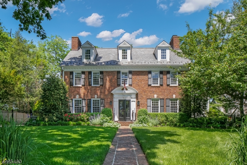 Expanded & updated, this classic Georgian presents beautiful detailing beginning w/ the home's exterior & continuing throughout 4 finished levels. A fabulous view to NYC is enjoyed from the rear lawn! Improvements over the years have yielded a fresh faced sunny classic ready for today's living.  Highlights include updated kitchen & baths, slate roof & gutters, exterior lighting, Andersen windows, layered crown molding, wainscoting, hardwood floors, fitted closets & 3 fireplaces. A finished lower level includes recreation & exercise rooms & cedar closet. Beautifully landscaped dining patio w/fire pit steps down to a level lawn. There is a multi-zone sprinkler system w/ rain detection. Bluestone wall & Green Giant Arborvitae provide privacy. Sought-after Northside location in the Lincoln Hubbard school district.