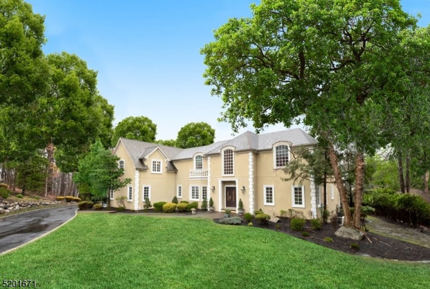 The combination of privacy, central location and acreage make this estate one of Franklin Lakes most special properties. Boasting over 5,600 sq. ft. of timeless design with 5 bedrooms, 5 1/2 baths and a first floor home office overlooking a serene parklike backyard nestled among mature trees and manicured gardens. You will enjoy all that nature has to offer sometimes watching deer frolic through the yard while sipping your favorite beverage from the deck. The home harmonizes spaces for everyday living and entertaining with a formal living room, family room which is open to the custom kitchen, a separate den and a gym which is located in the walk-out finished basement .Enjoy the suburban lifestyle in a magically self-contained environment with trails close by for hiking and easy access to highways. 30 min to NYC makes this the best of all worlds.