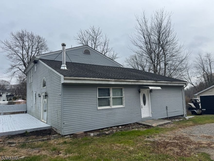 Welcome to 252 Wiscasset in Vernon, NJ. This spacious, lightly renovated contemporary offers approximately 2,800 square feet of living space. Updated kitchen, flooring, and fresh paint throughout. Upon entering, you're greeted by a large living room that opens seamlessly into the kitchen. The first floor features a master bedroom, and bathroom. The living room showcases a vaulted ceiling with shiplap accents, adding warmth and character. The second floor offers three additional bedrooms and a full bathroom. Outside, enjoy a huge deck perfect for relaxing or entertaining. Come see all this property has to offer!