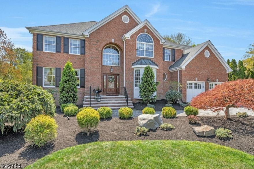 Do not miss this stunning Colonial situated on .55 acres at the end of a cul-de-sac in the highly sought after Afton Hills Estates. Pride of ownership is evident when you walk into this 4 bedroom, 3.1 bath home, designed with a refined blend of comfort and style. The open kitchen has a 6 burner Viking stove, high-end stainless-steel appliances. large granite island and custom cabinetry.  It seamlessly connects to the dining room, deck and an expansive, sun filled two story family room with a fireplace. No attention to detail has been spared with hardwood flooring and custom molding throughout the home. Upstairs is the beautiful primary bedroom with large walk-in closets, heated flooring in the bath and the other 3 bedrooms. The fully finished walkout basement expands the living space and takes this home to an entirely new level. It showcases a second kitchen equipped with a Viking stove and granite countertops.  Additional features include a second laundry room, full bath with shower, and space for entertaining highlighted by a cozy fireplace. The walkout leads to an outdoor oasis with a fabulous pool, hot tub, built-in grill, seating by the outdoor fireplace and a beautifully designed and maintained back yard, perfect for elegant entertaining or serene relaxation.