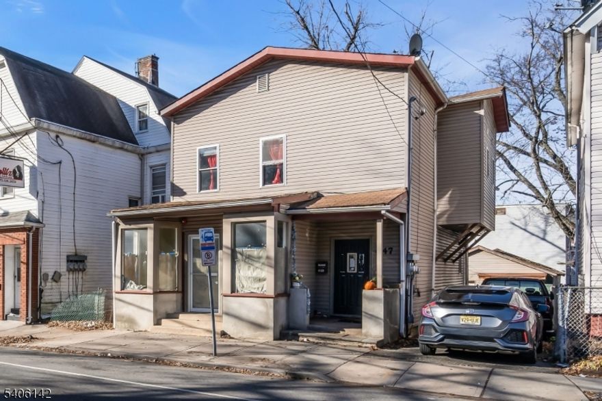 Welcome to this updated 3-bedroom, 2nd-floor apartment paired with a freshly renovated mixed-use storefront below. The upper-level apartment offers a comfortable layout with three well-sized bedrooms, an eat-in kitchen, and good natural light throughout. The unit delivers a practical, move-in-ready feel with recent updates and solid overall condition.On the first floor, the vacant mixed-use commercial space features two bathrooms, updated plumbing, and central A/C and forced hot air making it ideal for a variety of business uses. The space has also been recently renovated, offering a clean foundation for an owner-occupant or investor strong opportunity for rental income, business use, or a combination of both.