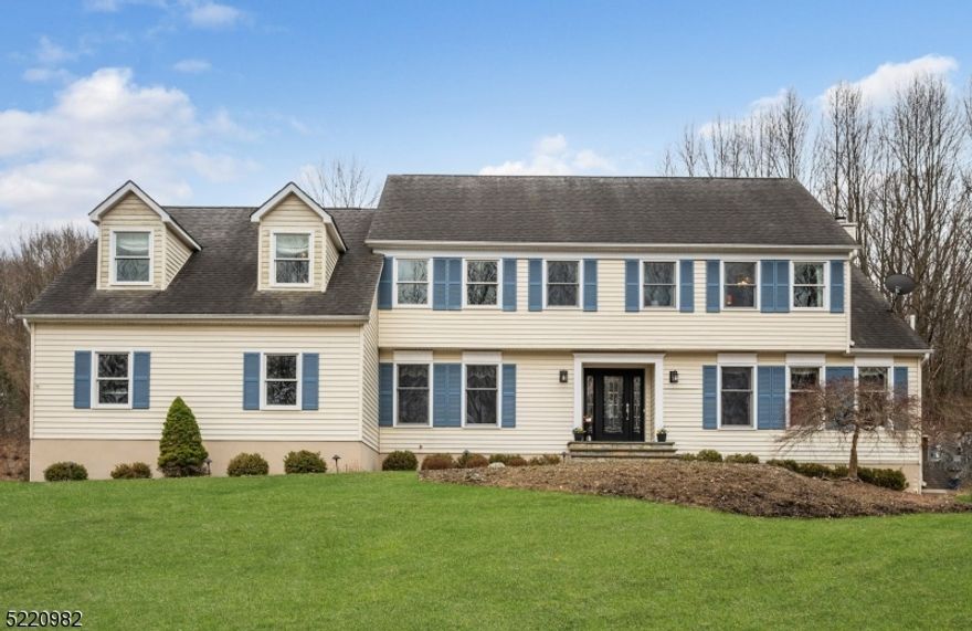 A light filled foyer welcomes you to this low maintenance and completely move-in ready center hall colonial. Engineered Brazilian cherry floors throughout the first floor warms the interior of this lovingly updated and cared for home. Maple and granite kitchen with stainless appliances is open to a stepdown family room with wood burning fireplace. There is an office with a closet on the first floor adjacent to the updated full bath and stall shower; a mud room as you step in from the 2-car garage, sliders to the new composite deck, formal living and dining rooms complete the first floor.The upper-level features 4 spacious bedrooms, 3 of which feature oak flooring and ceiling fans, plus a bonus room that could be used as an office/playroom/workout area accessible from two of the bedrooms. The primary suite offers a huge outfitted walk-in closet, 2 dormers with window seat storage, 3 massive storage closets and luxurious bath with steam shower. Other features worth mentioning: brand new septic to be installed before closing, full finished basement with storage room/workshop, 2nd floor laundry, whole house fan, generator hookup, extra attic insulation, updated energy efficient Anderson windows, private yard in a desirable cul-de-sac neighborhood, beautiful wooded views, lots of built in storage in garage, new common driveway, new septic, Long Valley schools and West Morris Central High School with IB program. Port Murray Mailing address 07865.