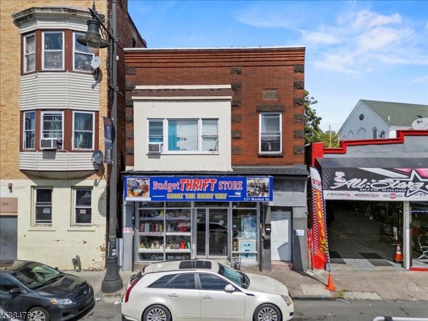 Versatile mixed-use property featuring two residential apartments and a commercial storefront. The first apartment offers 2 bedrooms rented for $1700, while the second features 4 bedrooms is currently rented for $2700, both providing excellent rental income potential. In addition, the ground-floor commercial store is can be rented for $3000, ensuring immediate cash flow for the new owner.Located in a high-demand area with strong rental market, this property is ideal for investors seeking steady income and long-term value. Conveniently situated near shopping, dining, transportation, and major highways.