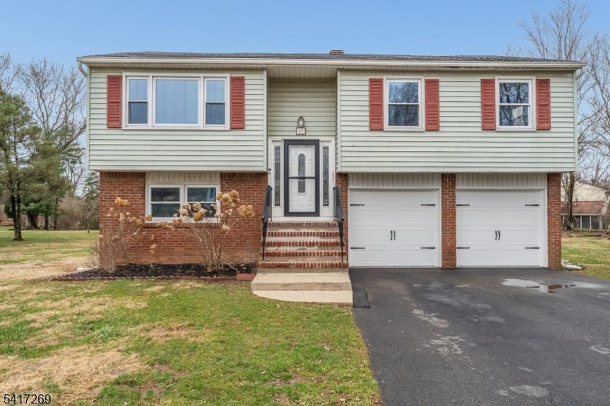 Beautifully Updated Home on Expansive Property, updated in 2016, features granite countertops, wood flooring, stainless steel appliances, and an updated HVAC system, offering modern comfort and style throughout. The kitchen flows seamlessly into the living areas, creating a warm and inviting space for everyday living and entertaining.Situated on a generous .73-acre property, the home offers plenty of outdoor space to enjoy. Step outside to a large expanded 20 x 16 deck, perfect for relaxing, entertaining, or enjoying the peaceful backyard setting.The home offers four spacious bedrooms with ample closet space, providing comfort and functionality for family and guests alike.Ideally located in a great neighborhood close to schools and the community pool, this home is close to everything while still nicely tucked away for privacy.New garage doors. Hot water heater 2021. A wonderful opportunity to enjoy space, updates, and location all in one property!