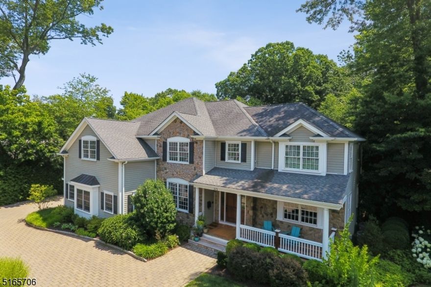 This spectacular 5 BR 5 1/2 bath colonial, in a fantastic neighborhood close to town, is stunning with impeccable contemporary, designer & trending updates & beautiful architectural detail & features, incl 5 fireplaces, an airy fl plan, spacious & sunny rms. A magazine-quality designer kitchen, one of the many showpieces of this home, boasts ultra-high-end appliances & finishes, a lge quartz island, custom cabinetry, a farmhouse sink, a magnificent La Cornue stove, a large pantry & a cozy dining area with a fireplace & a slider to an amazing yard. The 1st fl accommodates 2 professionals working from home, or adds add'l living areas. The 2nd fl features 5 BR, 4 full updated baths & a large laundry rm with ample storage. The primary BR suite boasts a gorgeous new spa-like bath, a sitting area with fireplace & two custom WICs. The other 4 BRs are spacious & bright, two are en-suite. The finished lower level with full bath adds approx 2,000sf & is amazing with architectural moldings, a large game/rec area, a theater/play rm, a gym/bonus rm, plus 2 storage rms. The private level yard is an oasis surrounded by prof designed lush ornamental, specimen & decorative landscaping, a luxurious 12-person hot tub spa, a seating area around the masonry fireplace, a kitchen & a large blue stone patio for lounging/dining. Other conveniences include a mudroom, a wi-fi controlled garage w built-in Cabinets & storage & a natural gas generator. Chatham Twp address w/ Boro train pass availability.