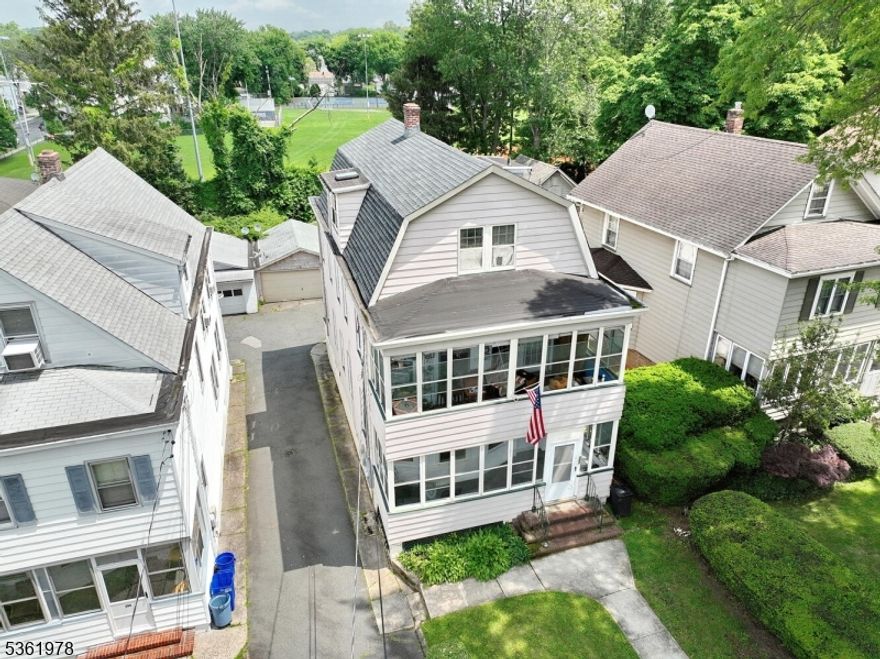 Welcome to this large two family home offering versatility and comfort for both owners and tenants. First unit has Eat in Kitchen, Living Room, DR, BR, FBTH, Enclosed front porch. Second floor is multi-level with Eat in Kitchen, Living Room, DR, BR, Full Bath and Enclosed porch. Ascend to the third floor where you'll discover even more space, featuring an additional living room (possible BR), two bedrooms, a kitchenette, and another full bathroom. This layout offers privacy and extra space. Full unfinished walk out basement with laundry hook up. Two car garage and two additional parking spaces, private backyard that backs to park. Oil tank has been removed, new electrical panel and meters installed and freshly painted. Generous layout, prime location, and investment possibilities. Close to NYC transportation.