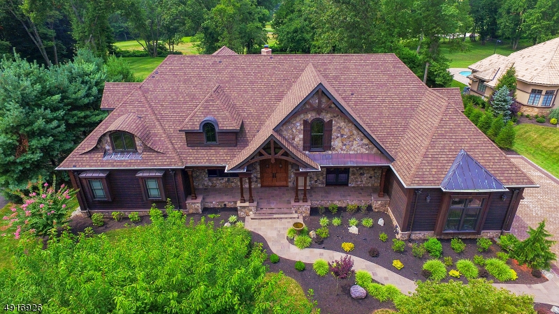 Stunning special custom home, builder built and owned, high efficiency everything, too much to list! Oak beams and timber trusses throughout, 10 ft ceiling, best lot in Watchung on the golf course! 3 car garage, 4 bedrooms, 3.5 bathrooms, 2 fireplaces, inside and out, big outdoor covered patio, big office with separate entrance, 1.5 acre property. Full basement with 10" ceilings, easily finished 2nd floor space, great house to grow into! Top notch school system! A lot of potential upgraded space. You have to see this to appreciate it! Front and back covered porches, stone walkways, mature trees on the lot! Perfect for NYC commuters, less than a mile from route 78 and route 22. Approximately 40 min commute to Manhattan. 10 min to direct train into the city.