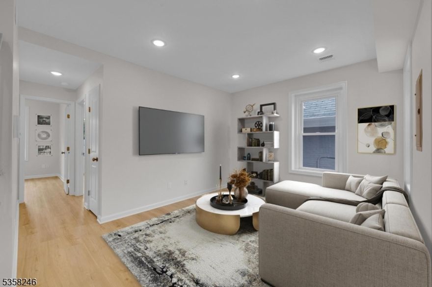 Section 8 friendly! Spacious Fully Renovated 3-Bedroom Apartment with Modern Comforts.  This beautifully renovated home offers the perfect blend of comfort, style, and convenience. Featuring 3 spacious bedrooms and 2 full bathrooms, this property has been fully updated in 2025 and includes luxury vinyl plank flooring throughout.Stay comfortable year-round with central air conditioning and forced hot air heating. The primary bedroom boasts a generous amount of closet space, while the updated kitchen comes fully equipped with a refrigerator, gas-range stove, microwave. With a washer, dryer and an intercom system to speak to guests at your front door, everything you need is already here to move right in. Outside, enjoy a large, shared, level yard, perfect for entertaining, relaxing, or play. Don't miss your chance to live in a like-new home that checks all the boxes! One off-street parking space in rear of home for tenant. Landlord pays water and sewer.