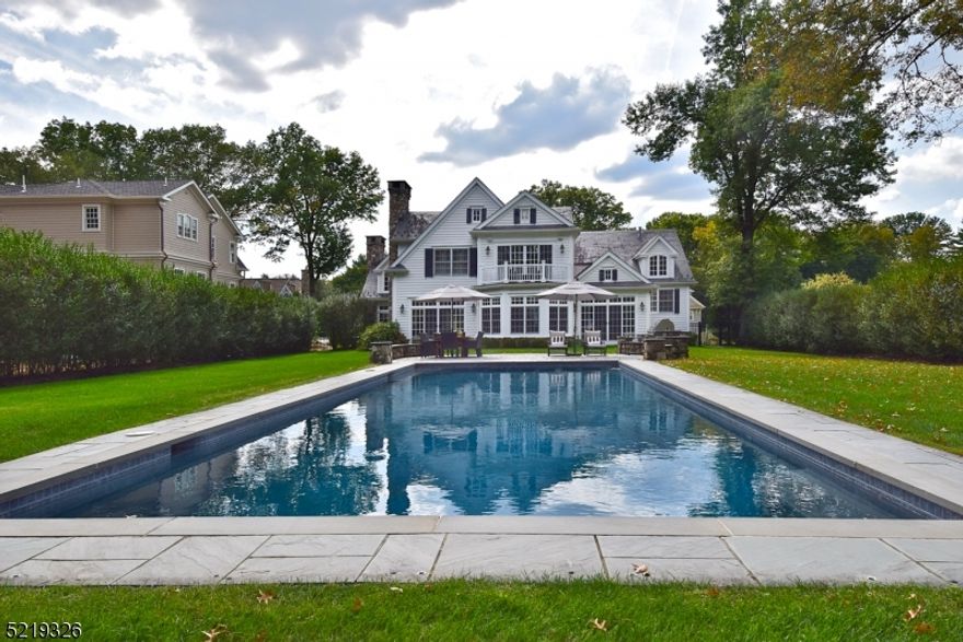 Incredible craftsmanship is evident throughout this impressive Rolling Hill 4 bedroom, 3.2 bath Custom Home! Be prepared to be amazed by the open and airy floor plan, timeless finishes, spacious rooms, and spectacular custom details. First level features the Living Room with wet bar, sundrenched Family Room with sliding doors to the fabulous backyard, a spacious home Office with a floor to ceiling stone fireplace. Designer Gourmet Chef's Kitchen features top-of-the-line appliances, custom cherry cabinetry, attractive soapstone countertops, and a large two-tiered center island with Breakfast Bar. The Kitchen also has convenient access to the fabulous backyard for seamless indoor/outdoor entertaining. Luxurious Primary Suite boasts spacious bedroom, expansive dressing room with custom cabinetry and his & hers closets, and spa-like en suite bath. Bedrooms 2, 3, and 4 (one is an En-Suite!) are bright and spacious with fantastic closet space. Finished Lower Level includes a Laundry Room, Recreation Room, and abundant storage space. Prepare to be wowed as you step outside to a flat lot with an enormous bluestone patio, built-in barbeque grill, inviting salt water pool!