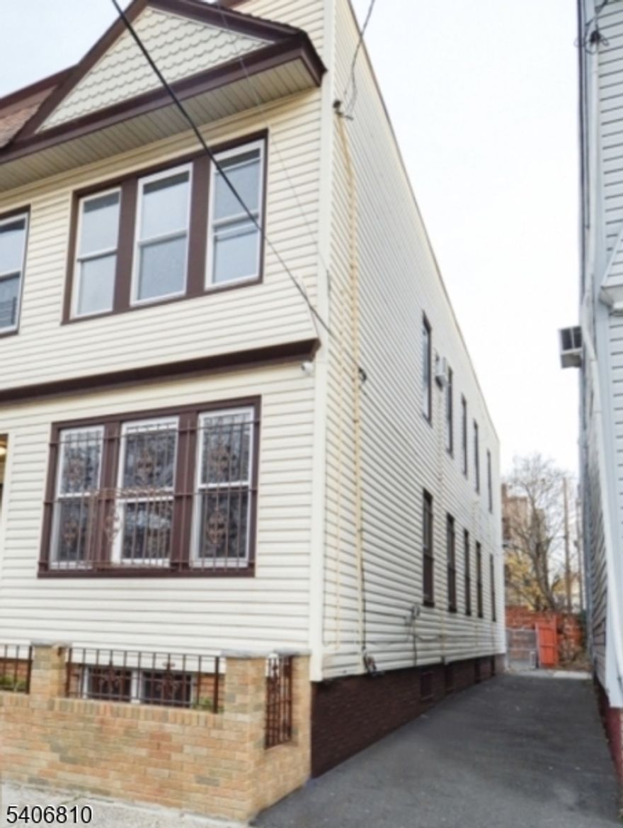 Incredible opportunity knocking! This well-maintained 4-unit multifamily property in the Upper Clinton Hill section of Newark, NJ features four spacious units, each offering 3 bedrooms and 1 bathroom with separate utilities and high ceilings, making it ideal for investors or owner-occupants. The full basement presents strong value-add potential, with the opportunity to be finished into two additional units if approved by the township or a laundry area and tenant storage for convenience. A shared driveway along the right side of the home provides access to a rear parking area with at least six comfortable parking spaces. Conveniently located near the Garden State Parkway, Route 280, and other major highways, this property also offers excellent access to NJ Transit, providing easy travel to Newark Penn Station, Newark Liberty International Airport, NJPAC, The Newark Museum of Art and a variety of popular restaurants and attractions. Please DO NOT park in the driveway. There is plenty of on-street parking for showings.