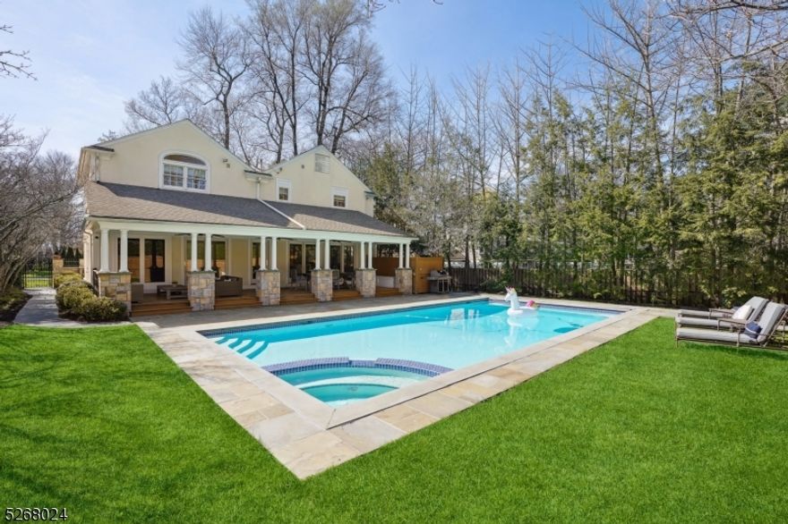 Don't miss this truly fantastic & completely renovated Colonial in a prime Lincoln-Hubbard Elem School neighborhood just 1/2 mile to the Summit Train Station.  Tucked away at the very end of a quiet street, this home's charming original details are seamlessly blended with modern amenities.  Sophisticated living begins with an inviting dining room w/fireplace perfect for entertaining (living room alternative).  Day-to-day living is a breeze with the open concept kitchen/family space that opens to an amazing covered mahogany porch overlooking a stunning heated in ground pool w/hot tub : 'staycation' living at it's best!  The second level has 4 bedrooms & 3 Full Baths including a huge Primary Suite w/vaulted ceiling, updated primary bath two large WICs (Laundry hookup in hall closet).  The lower level has a rec room, a huge half bath (possible full bath), a built-in bar/kitchenette w/wine frig, secondary full refrigerator and microwave drawer, plus a storage/utility room with laundry.  A convenient 1st floor full bath is ready for pool guests plus a formal powder room on the 1st floor. Enjoy a level, fenced-in yard w/ mature landscaping with wonderful privacy. Generac whole house generator included. This amazing home is in a perfect location close to Lincoln-Hubbard Elem, Summit Middle & High Schools, Kent Place School, downtown Summit, NYC transportation....a home that ticks all the boxes!