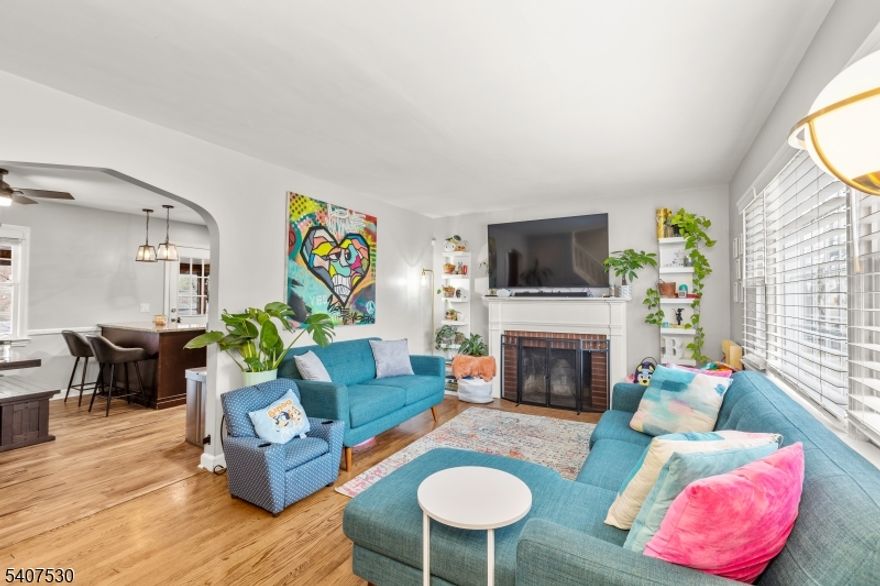 Introducing 128 E Roselle Ave, an elegantly appointed Cape Cod residence nestled along one of Roselle Park's most desirable, tree-lined streets. Beautifully renovated inside and out in 2021, this charming home blends modern upgrades with timeless comfort, offering 4 spacious bedrooms and 2 full bathrooms with two bedrooms and one bath conveniently located on the first floor, and two additional bedrooms, a full bath, and a lovely cedarwood closet on the second level. Step inside to a warm and inviting interior where natural light enhances the home's timeless character. The eat-in kitchen provides an intimate setting for everyday dining, flowing effortlessly into the gracious living room anchored by a classic wood-burning fireplace a beautiful focal point for both entertaining and quiet evenings. A bright sunroom extends the living space and opens to an expansive backyard, offering a serene outdoor retreat ideal for gatherings, recreation, or peaceful enjoyment. The home also includes a full basement, a 1-car garage, and a generous driveway accommodating multiple vehicles. Recent functional enhancements add peace of mind, including a new water heater, a radon fan, and a professionally capped chimney, ensuring comfort, safety, and long-term ease of living. Perfectly positioned in the heart of Roselle Park, NJ, you're just moments from the train, local bus lines, Route 22, I-78, the Parkway, and the Turnpike, making commuting and daily errands incredibly convenient.