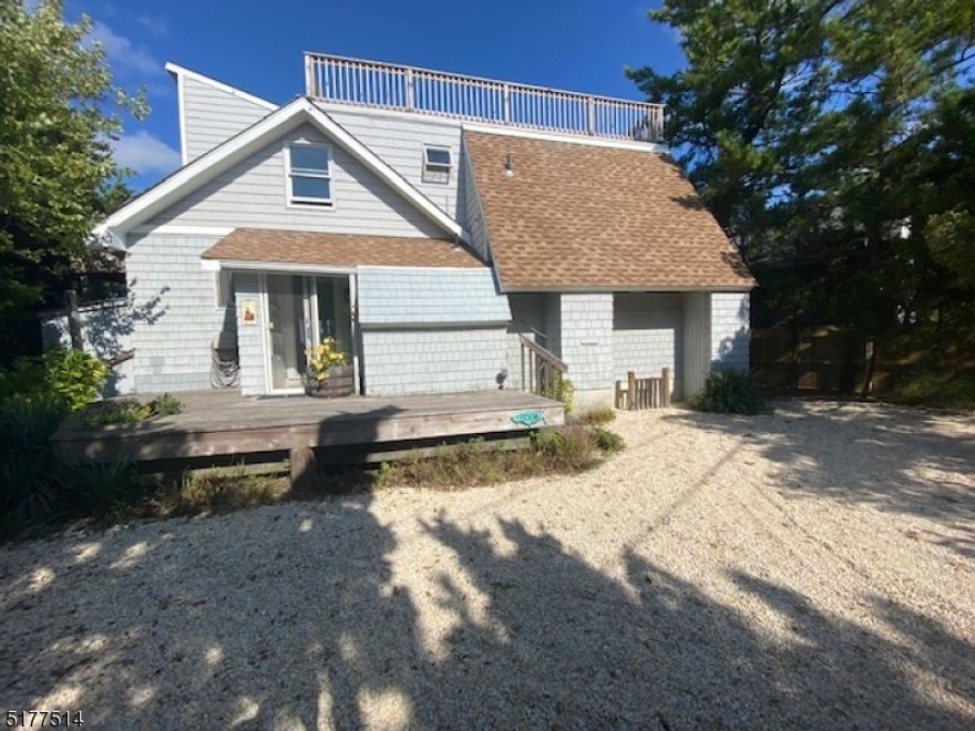A great opportunity to live on highly sought after Bay Terrace! This Bayfront 4BR home sits on an oversized 54' X 104' lot with 54' of bay frontage, 2 boat slips, breakwater, dock, riparian grant, boat lift & amazing bay & sunset views! This beach cottage has been added to over the years & now proudly boasts 4 BR's, 3 full baths, 2 family rooms, an open kitchen, screened in porch, plus sitting room or office off the master bedroom. There are views from every room & decks galore! Laundry room, tankless hot water heater, gas grill, outdoor shower & Bayfront deck make this home a must have! The short walk to town & beach allow for easy shopping & the best dining on the north side!  If new is what you are looking for, this property will accommodate over 2800 sq' of new living space. Kinsey Cove boat ramp is yards away to launch kayaks, paddleboards, PWC's and more! Come and enjoy the best that Harvey Cedars has to offer!