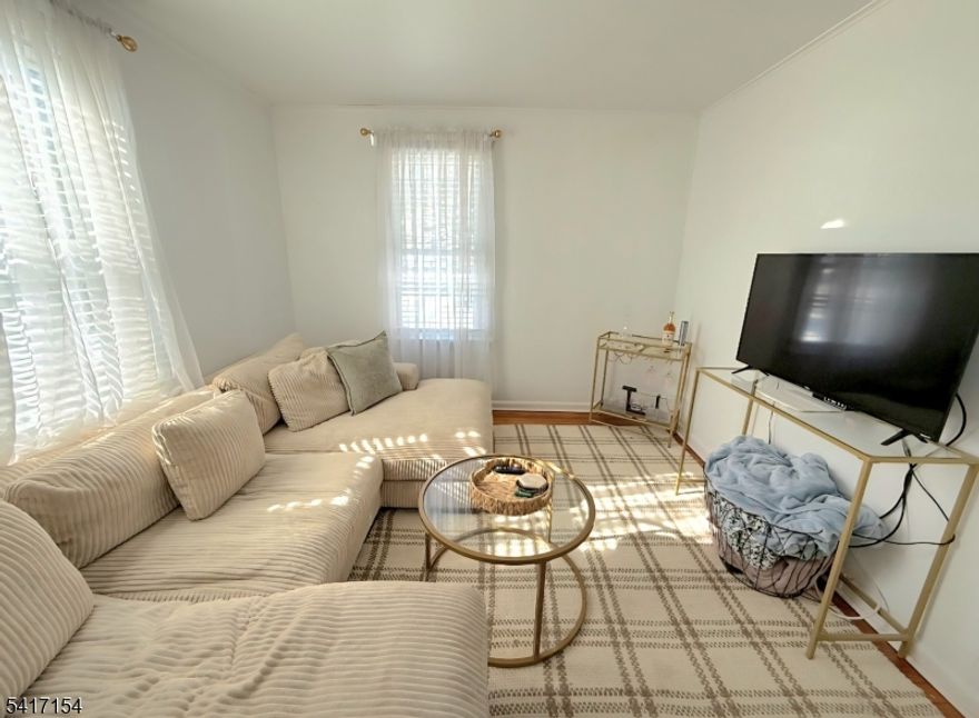 Bright second floor apartment with its own private entrance. Features a newer kitchen & bath, one bedroom plus office. Enjoy central air, in-unit washer/dryer and bonus attic storage. 2 off-street parking spots behind house. Convenient location close to public transportation, major highways & shopping.