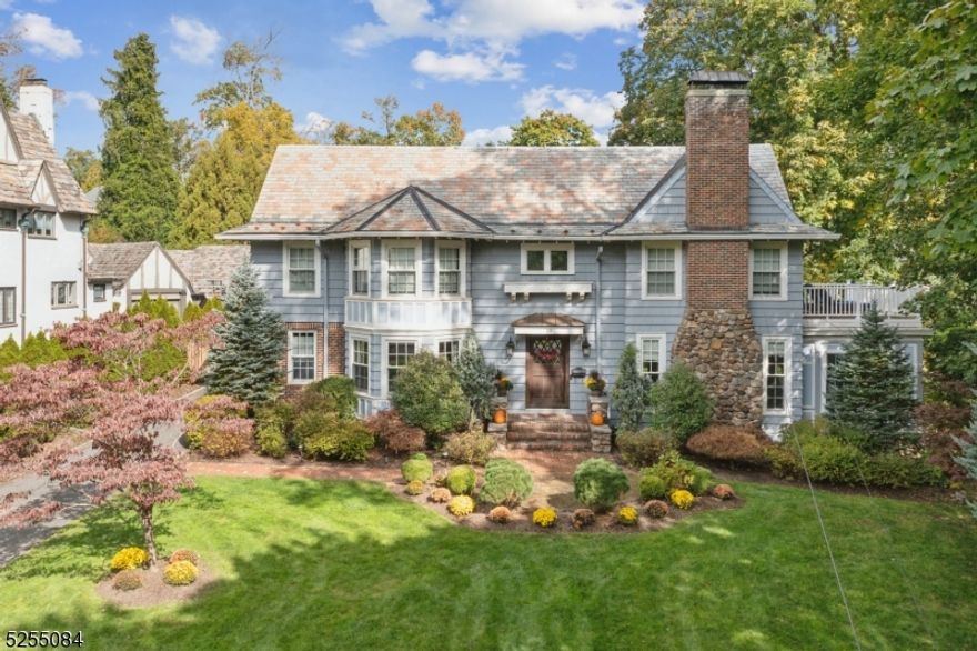 Magnificent luxury home, bright and welcoming.  From the entry foyer through the primary bedroom suite, this stunning home was thoughtfully renovated with impressive and unique features. Prestigious location amidst Maplewood's finest homes, while also short walk to village and NYC trains. Situated on nearly 1/2 acres of beautifully landscaped property, this elegant home was designed with stunning chef's kitchen with center island, gorgeous stone counters and high-end appliances.  Flow is maximized as it connects to dining room, family room, office and mudroom, as well as walk-out access to stone patio.  Fabulous master suite with  generous walk in closet/dressing room and bonus balcony. Custom baths including sumptuous marble master with huge shower. Gleaming hardwood floors, exquisite millwork and stunning period details and stained glass windows.  Finished basement, new boilers; 2-zone central air; new thermal windows; new stone patios and walkway; new sprinkers and more!