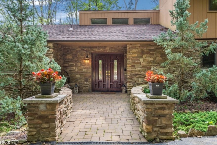 Step into contemporary elegance with this stunning stone facade home boasting a grand double entry. Embrace an open, modern floor plan featuring 3 beds, 2 full baths, and a sunken LR with a wood-burning fireplace for cozy nights. The first-floor primary suite offers a luxurious en-suite bath with double doors that open onto an outdoor deck. Upstairs, find 2 nicely sized bedrooms, a full bath, and a loft. Natural light floods the home, while high ceilings add to the spacious feel. Upgrades include a new roof (2020) and AC (2019), plus a converted two car garage for added versatility, this home is ready to shine with a little TLC. Double deck offers relaxation, the fence is damaged due to trees falling down. The backyard backs into town land for added seclusion. Enjoy the convenience of the circular driveway, ensuring easy access to the front door. Conveniently located near parks, trails, and amenities, seize this unique opportunity today! Being sold 'as is'. Photos are from 2020 and does not reflect the home's current condition.