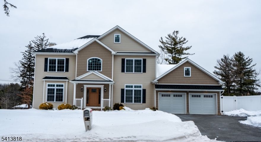 Beautiful 4-bedroom, 2.5-bath Center Hall Colonial located in the heart of Whippany. This home features hardwood floors throughout and a classic formal dining room perfect for hosting. The stunning white kitchen is equipped with stainless steel appliances, granite countertops, and a large center island, opening seamlessly into the main living space to create the ideal layout for everyday living and entertaining. A convenient first-floor laundry room and mud room add functionality, along with direct access to the two-car garage.Upstairs, you?ll find four spacious bedrooms, including a generous primary suite with a full bath and walk-in closets. Three additional bedrooms and a full hall bath complete the second level. The full basement provides ample storage space, while the large deck and fenced-in backyard offer the perfect outdoor setting for relaxing or entertaining.