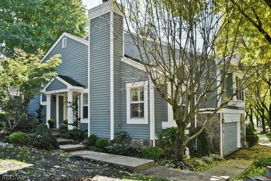 Welcome to 12 Knollcrest. This beautifully updated 3 BR, 2 1/2 bathroom end unit townhouse is situated  in the desirable Knollcrest section of The Hills. Plenty of light fills the home. HW floors throughout, newer kitchen with SS appliances, new range, refrigerator, and microwave purchased in 2021. Granite counter with a breakfast bar! Living room features a wood burning fireplace and sliding glass doors that lead to a large, private deck. Neutral paint throughout. First floor has family room with wood burning fireplace.  Expansive Master suite includes large walk in closet, remote control window treatments and a renovated bath. Laundry and powder room complete the second level. Third floor has an additional 2 bedrooms with their own bathroom. 3rd bedroom had a built in Murphy bed. Finished basement with den and a murphy door that leads to a meditation room.  New hot water heater installed in 2021. Whole house water filter and air purifier with Hepa filters, UV, and charcoal installed in 2021.  Garage has custom cabinets with plenty of storage and fiberglass flooring. Close to 78, 287 and train.  Low Taxes!! Great Schools! Community pool and tennis.