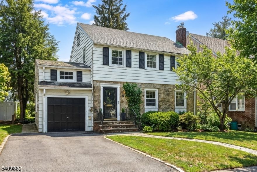 This beautifully scaled and well-appointed side-hall colonial set in Bloomfield's coveted Oak View neighborhood will steal your heart. Inside, a stylish interior showcases charming architectural character, refined finishes, beautiful wood floors throughout, and a spacious layout that flows effortlessly. The main living area, anchored by a classic wood-burning fireplace, transitions gracefully from room to room and unfolds into the spectacular expansive family room with built ins, floor-to-ceiling windows and skylights bathe the space in natural light. The sweeping views overlook a wide, fully fenced, backyard that is private & perfect for both everyday living and entertaining. The chic kitchen offers ample storage & marble countertops, move-in ready today with the opportunity to personalize over time. Upstairs, 3 bright good-sized bedrooms and a spacious main bath provide sanctuary and versatility. The large primary BR features Jack-and-Jill custom closets create a functional and serene retreat. The full attic provides excellent storage, while the high-ceilinged basement offers abundant space and excellent potential for future finished living areas. The convenience of the attached garage guarantees that you will always stay dry. Underground sprinklers, French Drains and a new sump pump. Set on a quiet residential street just two blocks from Bloomfield's sought-after Oak View School, NYC bus 2 blocks away, this is the kind of home that buyers wait for.