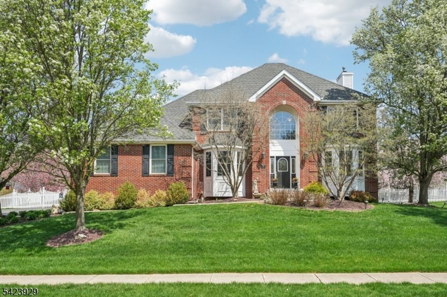 Welcome to this beautifully maintained 4-bedroom, 2.5-bath center hall colonial, perfectly situated on an oversized corner lot backing to protected farmland offering both privacy and scenic, unobstructed views. Step into a thoughtfully designed interior featuring custom kitchen cabinetry with elegant granite countertops, ideal for both everyday living and entertaining. The home also includes a cozy wood-burning fireplace, a fully finished basement complete with a game room and dedicated gym space, and a convenient two-car attached garage. Outside is where this property truly shines. Your private backyard oasis features an Anthony Sylvan heated in-ground gunite kidney-shaped pool, surrounded by cool decking for ultimate comfort. Enjoy the tranquil sounds of a koi-filled pond with a cascading waterfall, relax in the screened-in gazebo, and appreciate the charm of a white PVC picket fence enclosing the yard. Additional outdoor highlights include an underground irrigation system, storage shed, and flagpole. Additional upgrades include a Culligan water softening system, enhancing everyday comfort and efficiency. This home offers the perfect blend of indoor functionality and outdoor luxury ideal for entertaining, relaxing, and enjoying peaceful surroundings.