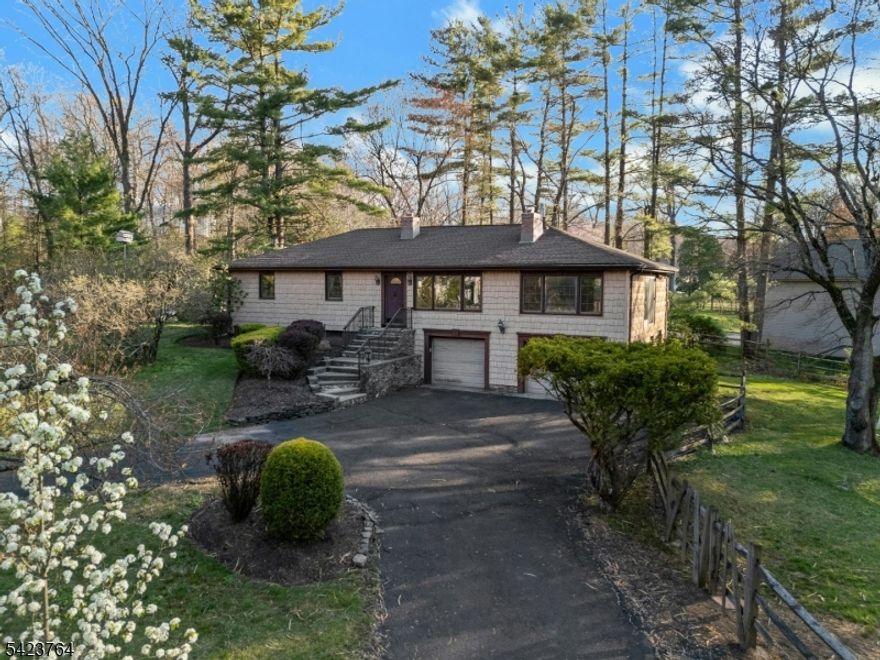 Welcome to 43 King George Road, a 2-acre flat property located in beautiful Warren where serene living meets endless possibilities! This charming raised ranch features three well-sized bedrooms, wood floors, and a gorgeously renovated full bath with custom marble tile work, a beautiful inlay design, and sleek glass doors. The thoughtfully updated custom kitchen is designed to impress! With custom ceiling height cabinetry, an industrial-sized KitchenAid refrigerator, a striking stone sink, and a breakfast bar, it's a dream kitchen for entertainers. The open layout creates an inviting flow, perfect for everyday living. The two oversized garages will be perfect for all your storage needs. The basement is a canvas waiting for ideas. With a full bath and tons of open space, the possibilities are endless. Set on a stunning, tranquil property, the outdoor space offers the perfect setting for your vision whether you dream of a lush garden retreat, play area, or simply enjoying peaceful surroundings. A whole-house generator adds year-round peace of mind. Just minutes from downtown Warren, the center of Martinsville, Route 22 & Highway 78. Don't miss the opportunity to make this property your own!
