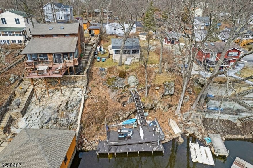 Calling all Investors & Lakelovers!!! Opportunity to own two single family properties in the Byram Cove section of Lake Hopatcong. One property - 329 Squaw (Block 50410 and lot 2) is lakefront and the other is adjacent to the other property. Lakefront house is 2 bedroom, 1 bathroom, galley kitchen, living room/dining room with amazing lake views. Walk down the steps to the dock. Two parking spots deed to home by the street. Second house - 331 Squaw (Block 50410 and lot 3 ) is 3 bedrooms, 1 bathroom with a large living room and eat in kitchen. House has 2 parking spots on crushed stone driveway. Properties have separate septic and shared well. Properties MUST BE SOLD TOGETHER.  Investors/Cash Buyers preferred. Properties have opportunity for membership at Byram Bay Community Club. Homes are being sold "AS IS" where is.