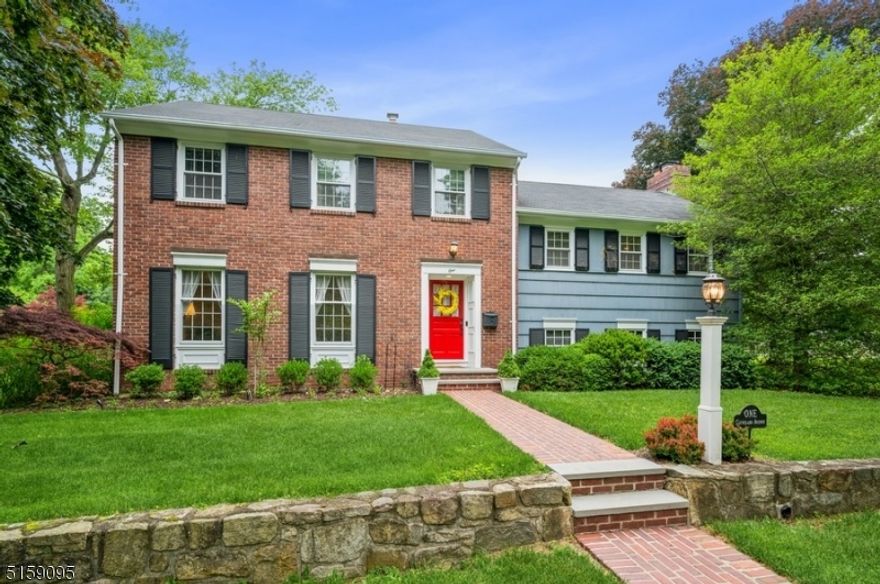 Rare quality and style in a highly desirable community setting! Elegant and unique! Custom Colonial home by architect Daniel C. Washington is nestled on an oversized and beautifully manicured lot on a tree-lined street in Morris Plains. This home is ideally located close to schools, shops, rest, and just a five-minute drive to NJ Transit direct trains to NYC. This spacious home features many exceptional details including hardwood and tile floors, elegant dentil crown moldings, and oversized windows for abundant natural light. The living and entertaining spaces flow outside to a sprawling bluestone patio overlooking an expansive back yard w/mature specimen trees, a vegetable garden, and a storage shed.  A charming brick walkway echoes the brick fa ade as you step inside to a large, bright foyer w/a powder rm and access to the attached 2-car garage. The living rm with rich hardwood floors and large windows flows to the formal dining rm featuring a chair rail and lovely bay window. French doors open to a fabulous four-season Fl rm w/a vaulted ceiling, three walls of windows offering tranquil views of the grounds, and access to the patio. The second floor includes a large family rm w/a fireplace, three good-sized bds, a full hall bth, and a convenient upstairs laundry rm. The primary bedroom has a WIC and its own private bth. Expanding the living space is a finished basement w/a rec-room offering ample space for a media center, office, exercise equipment, and a storage room.