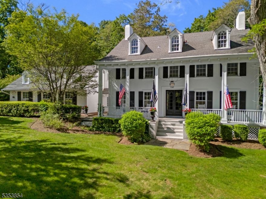 Once home to some of NJ's most prominent residents, the distinguished former Anderson Estate offers a rare opportunity to own a landmark property steeped in history and timeless elegance. Originally constructed in 1856 and masterfully renovated in 2012, this stately Georgian residence seamlessly blends historic grandeur with modern luxury, perfectly suited for elegant entertaining and refined everyday living. The columned facade is framed by a spacious covered porch, original shutters and period lantern lighting. Offering 7 BR / 5.1 BA, the magnificent interior boasts high ceilings, original wood doors, stunning restored millwork and hardwood floors throughout a versatile and inviting floor plan. Modern upgrades include new electric and plumbing, a 7-zone HVAC system, a built-in generator, and a new roof ensuring peace of mind without compromising the home's historical integrity. Every room is a must-see, impeccably layered in color, texture and natural light to preserve centuries of distinction thoughtfully designed for living, working, dining and entertaining. The gourmet chef's kitchen is a standout, featuring a butler's pantry, soapstone counters, center island, six-burner cooktop, 2 full-size ovens, and a custom paneled refrigerator/freezer. Outdoors, over an acre of landscaped grounds w bluestone walkways, stone garden walls, covered patios, and an expansive Trex deck creating a tranquil retreat just blocks from top-rated schools and downtown.