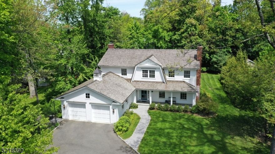 When a designer's purist vision meets a builder's immaculate craftsmanship, a masterpiece is created. This total-home reconstruction exudes an attention to detail in every inch. First impressions are created with the cedar roof, true divided-light windows, 6-panel glass front door, cupola, bluestone front porch; & this is only the exterior!Upon entering the generous foyer, a thoughtful flow carries through the main level. A large LR features a wood-burning fireplace that flows seamlessly to the DR.The white kitchen has a lrg center island, farmhouse sink, designer lighting & lots of windows.New updates include; redesigned floorplan, Andersen windows, HVAC, cedar roofing, cement composite siding, garage rebuild, & electric panel.The family room is adjacent to the kitchen & perfect for gatherings or cozy evenings. Gas FP with shiplap surround, custom built-in bookshelves, French doors leading to the amazing covered porch accented with a bluestone floor & white railing.The mudroom is unique in its design & function w/multiple storage options for today's busy lifestyles. A full basement has a generous rec room, recessed lighting, workspace & storage area.The 2nd floor has been reconfigured and thoughtful in its design. 4 BRs and 3 Full BA round it out. The primary suite has 2 lrg custom closets and spa-like bathroom.All of this nestled on 1 of Chatham Boro's most sought-after streets. A short walk to all of the top-rated schools, NY Direct train line, and downtown.