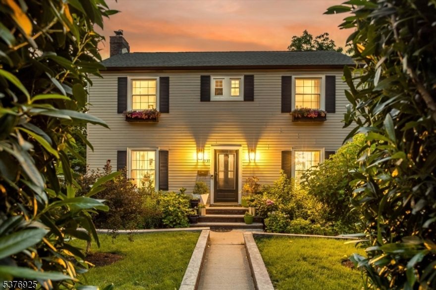 From NYC to Private Serenity! Step into a home where high design meets exceptional comfort - an inspired sanctuary, fully reimagined w artistic precision and meticulous attention to detail. A reinvention of space, style, and soul. The generous, sun drenched living room welcomes you w an elegant fireplace, walls of windows, & custom built-ins that add warmth and historic charm. Just beyond, the versatile family room offers space for relaxing, working, or play. Entertain with ease in the exquisite dining room, adorned w detailed wainscoting and classic crown molding. The chef's kitchen w quartz countertops, abundant cabinetry, modern appliances, & casual breakfast bar all come together to create a space as functional as it is beautiful. A chic powder room adds designer flair. Upstairs are 3 spacious bedrooms, including a serene primary w walk-in closet & direct access to a spa-inspired bath complete w soaking tub, oversized shower, & dual sinks. The basement is a showstopper w flexible studio/lounge, room for guests, stunning full bath, & even a Pinterest-worthy dog spa! Separate laundry room & attached garage add effortless convenience.  Outside, a designer's DREAM SANCTUARY unfolds: custom outdoor kitchen, curated garden, peaceful walking paths, seasonal blooms, shaded lounge areas, custom fire pit, and oversized hydropool swim spa for fitness and relaxation! This is more than a home it's a lifestyle of beauty, and serenity just BLOCKS from downtown, parks and NYC trains!