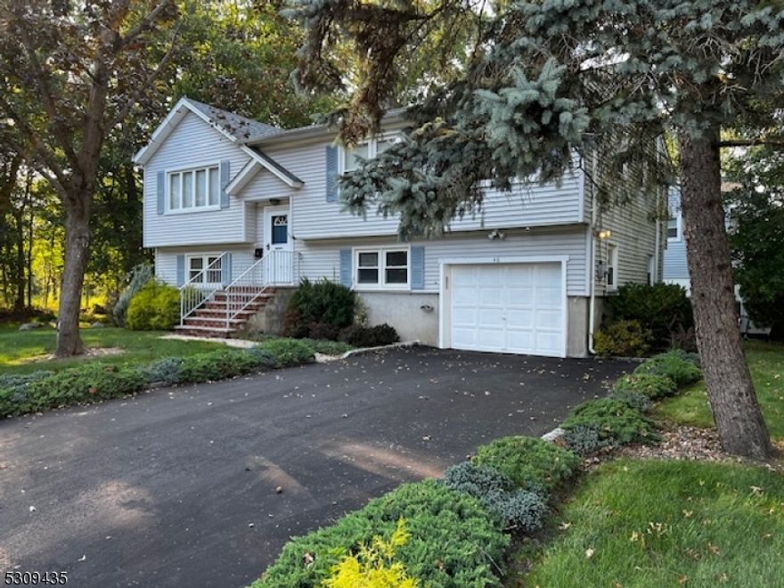 Step into this charming bi-level home, nestled on a quiet street in the peaceful Lake Parsippany community. While this home offers a fantastic layout and plenty of space, it also presents a wonderful opportunity for those looking to add their personal touch.Main Level: The second floor features a spacious kitchen that, while functional, could benefit from some modern updates to truly shine. The formal dining room opens into a large living room, providing a comfortable space for gatherings. Three generous-sized bedrooms on this level offer ample potential, ready for your creative vision. The expansive deck, accessible from both inside and outside, is perfect for BBQs and outdoor entertaining, with plenty of room for relaxation.Ground Level: The ground floor offers a wonderful recreation room with a charming brick fireplace as the focal point a great space for cozy evenings in. This level also includes an additional bedroom and bath, a laundry room, utility room, and convenient access to the garage. Sliding glass doors off the rec room lead to a patio, ideal for enjoying the peaceful surroundings and a bit of fresh air. Fireplace is as-is, no known issues.This home is a great opportunity to create the living space you've always wanted in the desirable Lake Parsippany area.