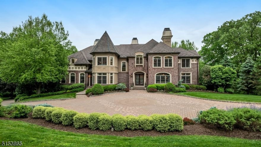 Welcome to this 6 bedroom, 5 full and 1 half bath beautiful French Chateau in the sought after Valhalla Estates section of Montville, NJ. This home is truly a must-see, featuring the highest quality finishes, moldings, Brazilian cherry hardwood floors, and architectural features. Enter through the 2-story foyer with cast-iron spiral staircase to find formal living and dining rooms, a sunroom, library, media room, a bedroom suite, laundry room, and a 2-story great room with fireplace and access to the large deck overlooking the backyard. The Chef's gourmet eat-in kitchen is complete with a center island, stainless steel appliances, and a separate breakfast room. The oversized master bedroom suite features a sitting room, 2 walk-in closets, and a luxurious master bathroom. Three additional bedrooms, 2 full bathrooms and a bonus/music room complete the second level. The full, finished lower level is perfect for entertaining with its recreation areas, wet bar, and a guest bedroom with a full bath. Home also features an attached 4-car garage and a large, meticulously landscaped backyard.