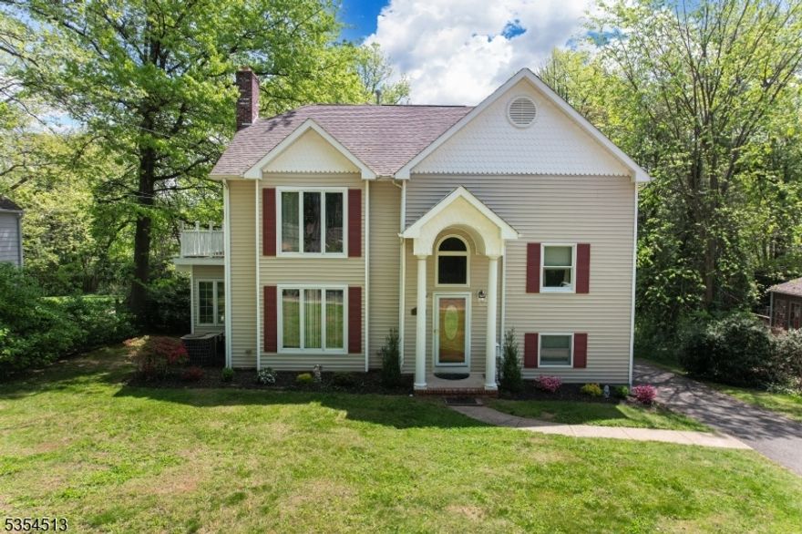 Stunning Custom Colonial 4 Beds 4.5 Baths in Prime Westfield Location. Just one block from Washington School and under a mile to downtown Westfield and the train. The main level offers a formal living room with gas fireplace, formal dining room, and a gourmet kitchen with high-end stainless steel appliances, under-cabinet lighting, and an oversized breakfast bar. Anderson windows and doors throughout provide excellent light and efficiency. French doors open to a wrap-around Trex deck and a private, park-like yard perfect for entertaining or relaxing. The second floor includes two spacious bedrooms and a full bath. The third floor features a luxurious primary suite with gas fireplace, jetted tub, steam shower, walk-in closet, and a bright loft with skylights (possible 5th bedroom). A large additional bedroom with private balcony, another full bath, and laundry room complete the level. Full-length attic offers extra storage. Walk-out basement has high ceilings, full bath, two private entrances, and second laundry room ready to finish as a rec room, gym, or guest suite. Added features: 3-zone heating, 3-zone A/C, 200-amp electric, built-in speaker system, and 1-car garage. Don't miss this exceptional home in the heart of Westfield!