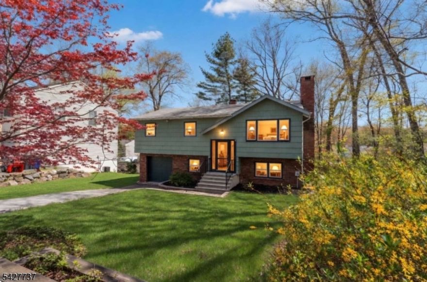 **SELLER IS OFFERING A $30,000 CREDIT TO THE BUYER AT FULL ASKING PRICE OR ABOVE, TO BE USED TOWARD NEW ROOF, DOORS AND WINDOWS.** Discover this welcoming 2-story single-family home in the desirable Hopatcong Hills community. Underneath the carpeting in the living room, dining room, upstairs hallway, and bedrooms are beautiful solid hardwood floors ready to be revealed. Inside you'll find a bright eat-in kitchen with oak cabinets, a cozy living room with brick fireplace, a wood-paneled secondary living room with wood stove, multiple bedrooms (one currently a nursery), updated bathrooms, laundry with W/D, and an attached 2-car garage. As part of the Hopatcong Hills HOA, residents enjoy access to the community beach house, private lakefront privileges on Lake Hopatcong, maintained common areas, and recreational amenities. Just minutes from the Lake Hopatcong NJ Transit train station and close to Hopatcong?s top attractions including Lake Hopatcong and Hopatcong State Park. A solid home in a prime lake-area location with excellent potential!