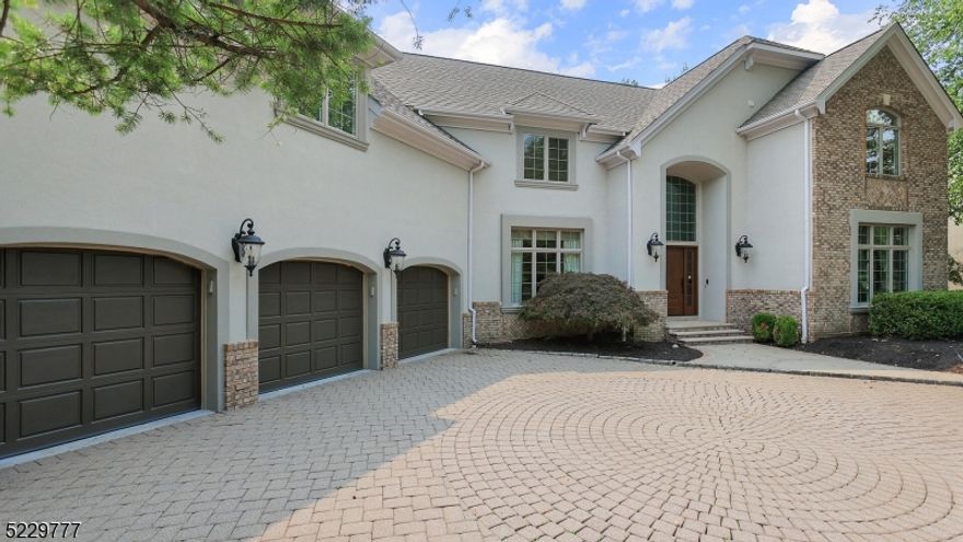 Brilliant, move-in ready Custom Home located in highly sought after Sycamore Estates neighborhood in Warren. Offers an elegant combination of classic & modern chic design elements throughout. Fine artisan craftsmanship on full display w/ herring bone hardwood floors, bespoke wood trim moldings and custom built-in shelving & cabinets. Main level highlighted by a bright & airy chef grade gourmet kitchen, ready to indulge in many culinary adventures and is complete w/ high-end appliances, large prep island, walk-through butler pantry w/ wine fridge and an oversized eat-in kitchen space. Create lifelong memories in the grand two-story family room which boasts a custom gas fireplace and expansive windows overlooking the lush backyard area. Main level office provides an ideal work from home space. Upper level boasts a primary bedroom retreat w/ vaulted ceilings, dual walk-in closets and an en-suite w/ dual sink vanities, steam shower and soaker tub that overlooks the rear yard. Completely finished lower level is highlighted by full bathroom, bedroom, wet bar w/ wine fridge, gym w/ hot yoga area and space for recreation & hobbies. Limitless indoor & outdoor entertaining opportunities await, thanks to a surround sound system and a large outdoor deck leading to the property's level, mature & privately landscaped backyard. Located in an excellent school district.