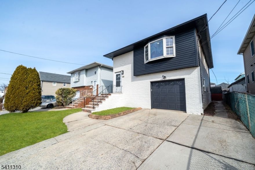 If you've been waiting for a home that feels manageable, move-in ready, and flexible enough to grow with you, this one is worth a look. This fully renovated three-bedroom, two-bath home in Linden offers a bi-level-style layout designed for real life. With two living room spaces plus a den, the home provides flexibility for entertaining, working from home, play space, or simply having room to spread out.The lower level features a bedroom, a living room, and a den, while the upper level includes additional bedrooms and a second living space filled with natural light from beautiful bay windows. The thoughtful renovation balances comfort and functionality throughout.Outside, enjoy a spacious backyard ideal for relaxing or entertaining. An attached one-car garage and driveway provide parking for two vehicles. Conveniently located near major highways, public transportation, shopping, and dining, this home offers easy access to daily essentials. Linden's strong commuter access to NYC and growing local amenities make it a great place to put down roots.