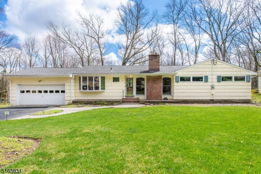 Deceivingly large Ranch featuring 5 bedrooms, 2 full & 2 half baths. Sun filled Living Room with large windows, slider to deck and wood burning fireplace. Updated Kitchen with Cherry wood cabinets, granite counters and stainless steel appliances. Hardwood floors throughout including Tiger Wood floors in master bedroom, other bedroom and dining room. Large Main Bath with double sinks, jetted tub and separate shower. Finished basement. Private deck overlooking park like setting backyard. One floor living at its best! Conveniently located to all commuting routes, NYC train, Stardust Pool and all that Morristown has to offer. Public utilities! Low Morris Township Taxes!