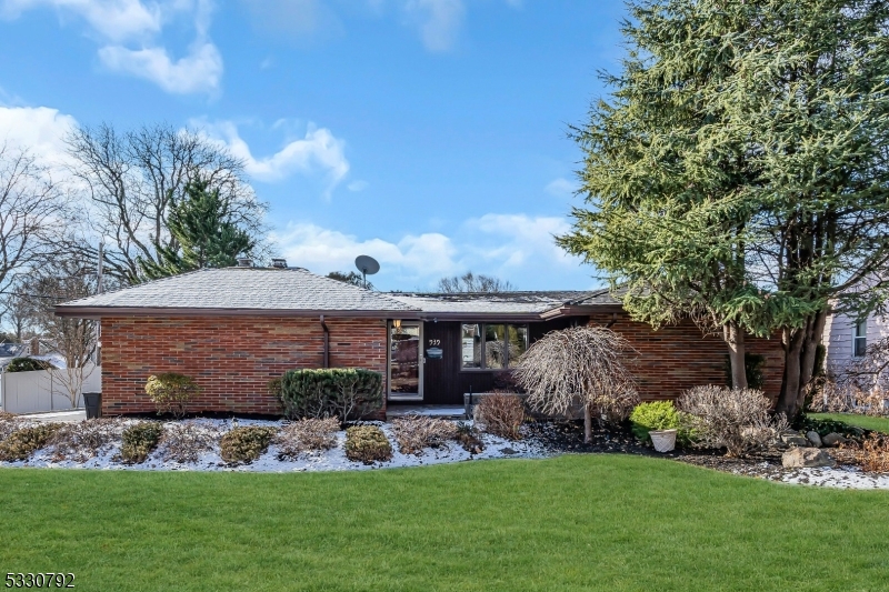 Charming Brick Ranch with Spacious Living Areas. This beautifully renovated brick ranch features three bedrooms with a potential fourth bedroom in the basement, two full bathrooms, and one half bathroom, offering a perfect blend of comfort and modern updates. Step into the heart of the home with an updated eat-in kitchen, complete with ceiling-height wood cabinets that provide ample storage and a stylish, functional space for meals and gatherings. The master suite is a true retreat, complete with sliding doors that lead directly to the backyard, offering seamless access to your private outdoor oasis. The en-suite master bathroom includes a stand-up shower for added convenience and comfort. The inviting living room boasts a cozy fireplace, perfect for chilly evenings or casual relaxation. Step outside to your own backyard paradise with an in-ground pool, ideal for relaxing and entertaining in style. The finished walk-out basement expands your living space with two separate areas and a convenient half bath, providing plenty of room for various activities. This home offers a perfect combination of indoor comfort and outdoor tranquility. Don't miss the opportunity to make this stunning property your own! Close proximity to public transportation and convenient location close to schools, highways, shopping and more!