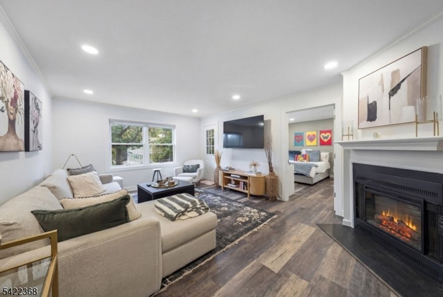 Completely renovated 2 Bedroom, 1 Bathroom condo at 19C Heritage Drive offering stylish, move-in ready living in a prime Chatham location. This bright and inviting home features a spacious Living Room with a cozy fireplace and door access to a Private Deck perfect for relaxing or entertaining. Right off the Living Room is the Eat-In Kitchen, beautifully updated with white cabinetry, stainless steel appliances, a center island, and a double window that fills the space with natural light. Just off the foyer, a convenient Laundry Room with washer and dryer adds everyday functionality and ease. The Primary Bedroom features a double window and a generous Walk-In Closet with custom shelves built for maximum storage and utility. The Second Bedroom features a double window overlooking the deck. An updated Full Hall Bath includes a tub/shower combination. Updated with ample recessed lighting throughout. Ideally located close to town, shopping, restaurants, and public transportation, this turnkey condo combines comfort, style, and convenience.