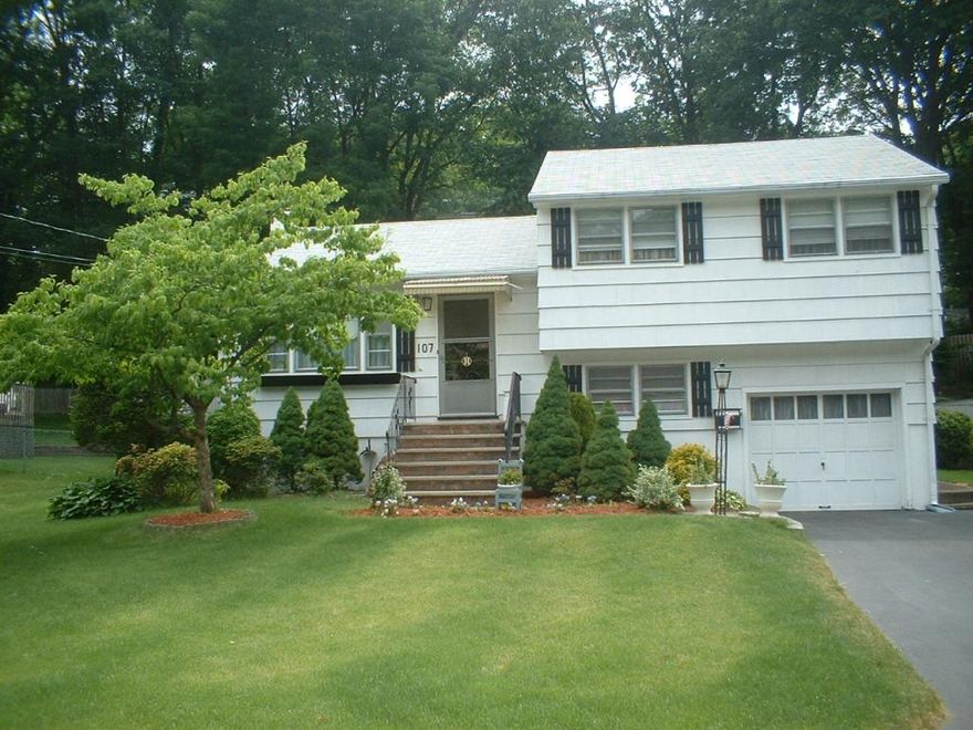 Situated in one of Mendham Township's most prestigious neighborhoods, 47 Corey Lane blends historic charm with modern luxury. Built in 1999 by a renowned local builder, the main residence seamlessly connects to the original circa 1752 home via a curved sunlit gallery hallway. The original structure now serves as a breathtaking great room with soaring 20-ft ceilings, original wood beams, and a grand wood-burning fireplace perfect for entertaining or relaxing. This crisp, meticulously maintained transitional Colonial features 10-ft ceilings, hardwood floors, and custom 12-inch moldings. A two-story foyer welcomes you into the home with gleaming hardwood floors and extensive millwork. The gourmet Canterbury kitchen boasts custom cabinetry, granite countertops, two sinks, high-end stainless steel appliances, a center island, gas fireplace, desk, bar, and dining area. The living room showcases elegant moldings, built-in bookcases, window seats, designer wallpaper, and a gas fireplace. The property offers resort-style amenities on five acres, including a heated gunite pool, a serene pond with koi fish, and an expansive bluestone patio with an outdoor kitchen. In winter, enjoy ice skating, and in the summer, relax poolside.