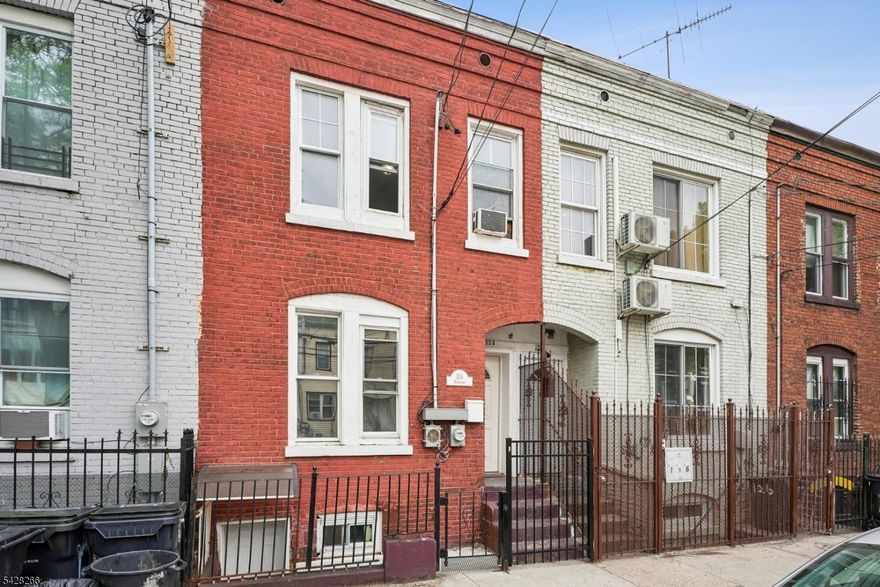Welcome to this beautifully maintained brick row home nestled in the heart of Newark's sought-after North Ward just moments from the iconic Branch Brook Park home to the largest collection of cherry blossom trees in the United States featuring over 5,000 trees and vibrant seasonal events.This versatile home offers 3 bedrooms and 3 full bathrooms, designed for both comfortable living and flexible use. The main level features a functional kitchen full bath dedicated office space and convenient washer/dryer hookup with direct access to a private backyard perfect for entertaining or relaxing.Upstairs you'll find two generously sized bedrooms and hallway leading to a full bath creating a bright and inviting living space. The fully finished basement with its own separate front entrance includes a bedroom full bathroom and dine-in kitchen offering a great setup for extended living or additional possibilities.Enjoy being just one block from scenic walking paths tennis courts food trucks and year-round recreation. Located near major highways public transportation and a variety of local restaurants this home offers both convenience and lifestyle.Don't miss this opportunity to own a home that combines comfort versatility and location.