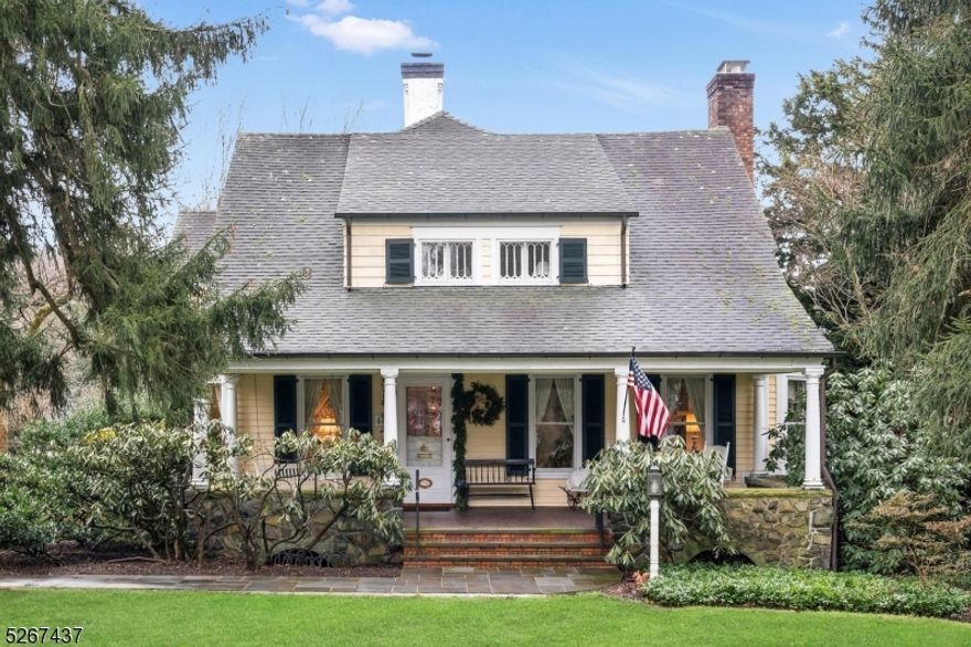 This truly Special  home offers Endless Possibilities! This classic 5 Bedroom Colonial is Perfectly Poised on one of the most Picturesque and Park-Like Summit  Properties. Set upon 1.34 acres surrounded by mature landscaping, 68 Valley View is one of a kind!  The turn of the century home offers fine architectural details, including an inviting front porch, welcoming foyer with a gracious curved staircase, hardwood floors that flow seamlessly into the Elegant Living Room with beamed ceiling, Formal Dining Room accented with lighted corner cabinetry. Custom Cherry Kitchen with Center Island, new stainless appliances with the added charm of a gas fireplace all set upon reclaimed hardwood floors is truly the heart of the home.   A must have home office is located nearby as well as the Family Room with built -ins and and a wood burning stove perfect for cozy gatherings. The second floor is host to 5 bedrooms with a sun lit Primary Suite and Bath. The finished third floor offers versatility as a bedroom or office.The full basement features a recreation room, utility and storage rooms, and an outside entrance.  An added bonus is the newly built oversized 3 car detached garage with a staircase to the second floor loft. Ideally located in a coveted neighborhood just blocks from Franklin Elementary School. This rare Summit offering presents a wonderful opportunity to create your dream home!