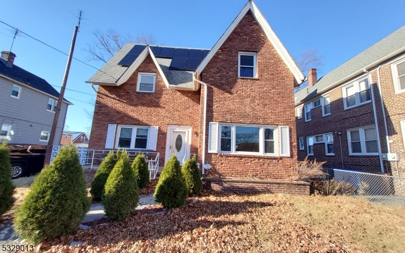 Welcome to this beautiful, updated brick colonial featuring a charming front porch, driveway for 2 cars, and solar panels. The first floor offers a living/dining room, eat-in kitchen with stainless steel appliances and granite countertops, a large bedroom, and a renovated full bathroom with new flooring throughout. The second floor includes 3 bedrooms and a full bathroom with a whirlpool tub. The finished basement features a kitchenette area, full bathroom, 3 rooms, and a utility room. Additional highlights include a new forced air/central air unit, tankless water heater, Nest thermostat, new electrical panel, Nest alarm system, and sump pump. The basement also has a private entrance from the backyard. The huge backyard offers plenty of space for entertainment. Also, the driveway fits three cars. Conveniently located near parks, playgrounds, schools, transportation, highways, shopping, and houses of worship.