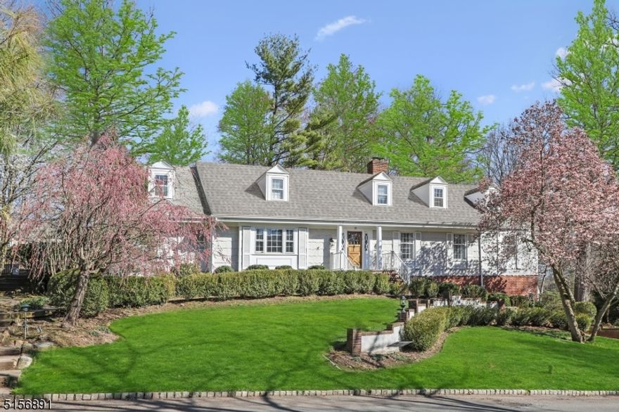 Set on generous grounds in the heart of Short Hills, this 6+ bedroom, 3.1 bath Colonial is located in one of the most convenient locations, close to Short Hills Train station with frequent trains to Hoboken and New York City, Hartshorn Elementary School and easy access to many major highways. You'll immediately be welcomed by the elegant double-height foyer while the Living Room opens to the generously sized Dining Room. The chef's Kitchen boasts an oversized island, high-end appliances & plenty of cabinet space. The adjacent Family Room is the heart of the home & provides abundant light through multiple skylights & french doors that lead to the patio.  The park-like property includes landscaping with blooming perennials, mature trees for privacy & a Koi pond w/ a waterfall. Gorgeous views can be enjoyed from every room of the house. 11 Hemlock's sun-drenched rooms, prestigious neighborhood & private setting make it a dream home in every way. Fireplace, chimney, skylights, hot tub, conveyed as-is.