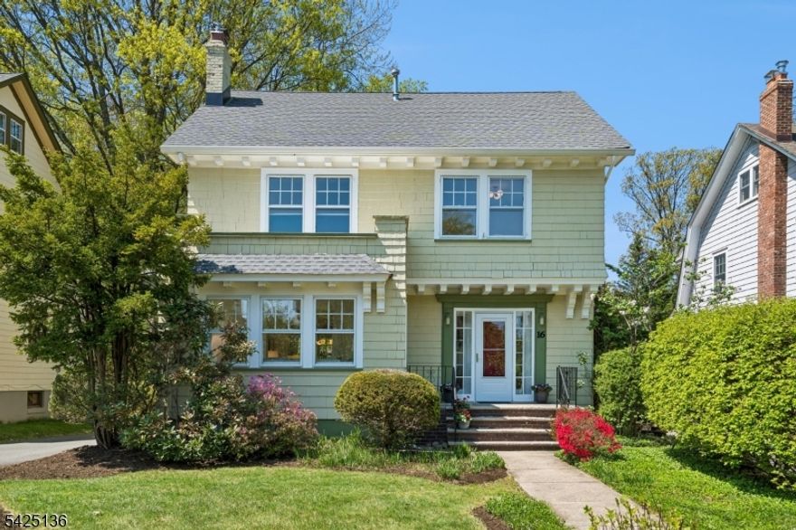 Welcome to this exceptional home in the heart of Upper Montclair Village. Situated on a quiet, tree-lined street, this property offers a true neighborhood feel while being just blocks from shops, cafes, parks, the library, top-rated schools, and convenient NYC-bound bus and train service.This charming five-bedroom Colonial features a welcoming front porch and timeless architectural details, including hardwood floors and classic moldings throughout. The spacious living room with a wood-burning fireplace flows seamlessly into a charming sunroom and a formal dining room with a window seat. The updated kitchen is designed for both function and style, offering stainless steel appliances, custom cabinetry, two large skylights, and a generous pantry. A bright breakfast area with built-in seating opens to a deck overlooking a spacious, level backyard ideal for entertaining or everyday enjoyment. The second floor includes four well-proportioned corner bedrooms and a full bath. The third level provides flexible living space with a recreation room, fifth bedroom, sink with potential for future bath, and ample storage. Additional features include a new roof, two-zone central air conditioning, and a detached two-car garage. With multiple options for home offices, bonus spaces, and entertaining areas, this home effortlessly blends classic charm with modern convenience in a fabulous Upper Montclair location!