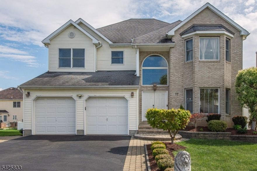 Welcome to this bright, spacious, and immaculate colonial in Mazdabrook! This original-owner home has been meticulously maintained and features a two-story foyer filled with natural light. The main level offers a large formal living room that flows seamlessly into the formal dining room, a huge eat-in kitchen with maple cabinets, granite countertops, and stainless steel appliances, and an expansive family room with a gas fireplace and bay window. A powder room and two-car attached garage complete the first floor.  The second level features a large primary suite with a tiled bath and two walk-in closets, along with three additional generously sized bedrooms and a full bath. The full unfinished basement offers high ceilings and is ready to be finished to your liking. Step outside to a gorgeous backyard highlighted by an expansive elevated patio with decorative masonry pillars and balustrade accents. Additional features include hardwood floors throughout most of the first level, crown moldings, recessed lighting in most rooms, a central vacuum system, a paver-lined driveway, a paver walkway to the yard, and recently refreshed landscaping.  Don't miss this beauty!